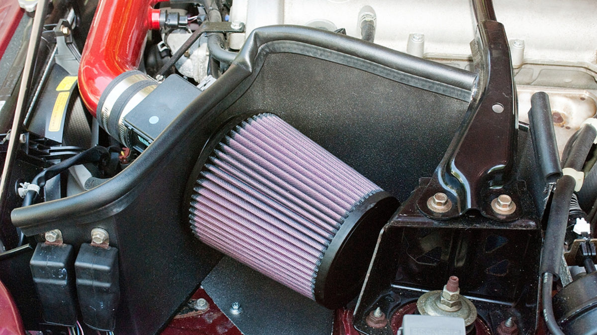 Red Car Enthusiast Class Universal Cold Air Intake Gulps in More Air for More Engine Power & Passionate Induction Sound 2.5 In Mortar Aftermarket Auto Air Filter Replacement