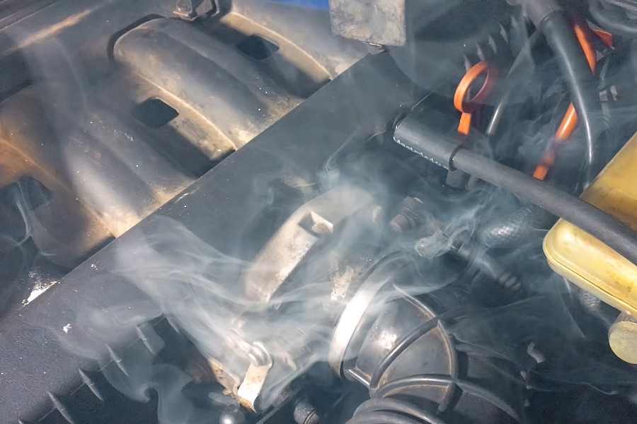 Why is my car's exhaust smoking?